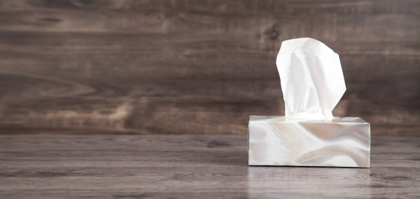 istock Napkin box on the wooden table. 1290024618