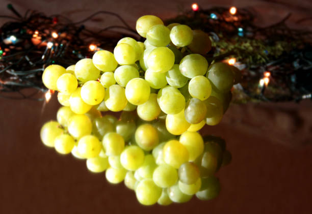istock A bunch of white grapes reflected in the mirror. 1290027664