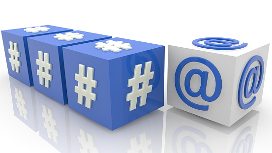 Cubes with hashtags and at sign concept