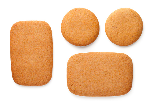 Gingerbread cookies in shape of rectangles and circles isolated on white background. Top view