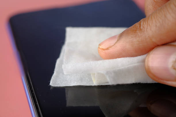 istock man hand cleaning mobile phone display for preventing virus 1290032003