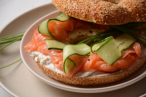istock Bagel sandwich with salmon, cream cheese, cucumber 1290032230