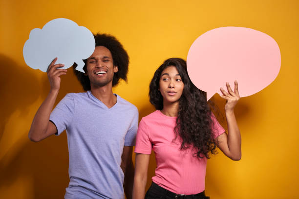 istock African couple holding a speech bubble 1290033886