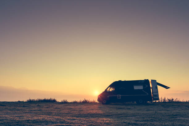 istock Camper car on nature at sunrise 1290035421