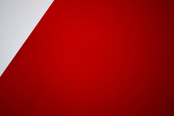 istock Red background with white corner. Colored paper background 1290035558