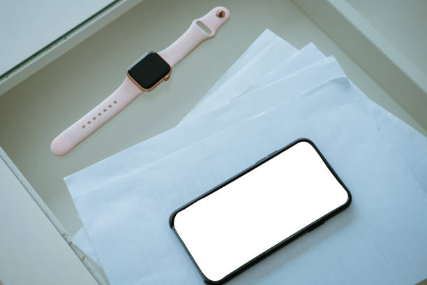 istock Phone and documents on the table with smart watch, business concept 1290036957