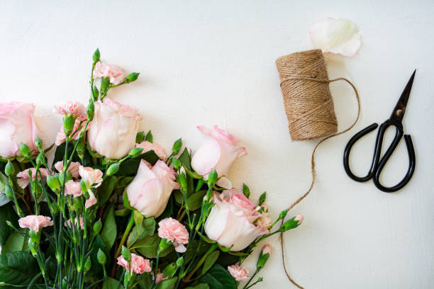 istock Overhead view of beautiful flowers bouquet, making 1290038543