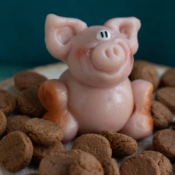 istock Marzipan pig with many pepernoten cookies 1290038977
