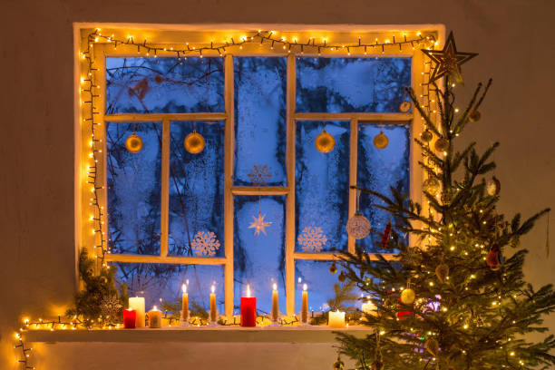 istock Christmas decorations on old wooden window 1290039063