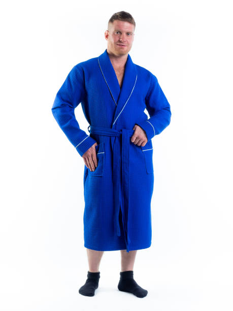 istock strong man in a Bathrobe on an isolated white background with a smile on his face. 1290040319