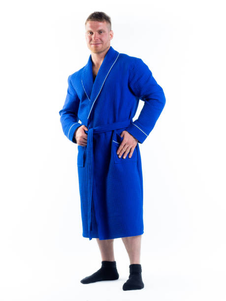 istock strong man in a Bathrobe on an isolated white background with a smile on his face. 1290040340