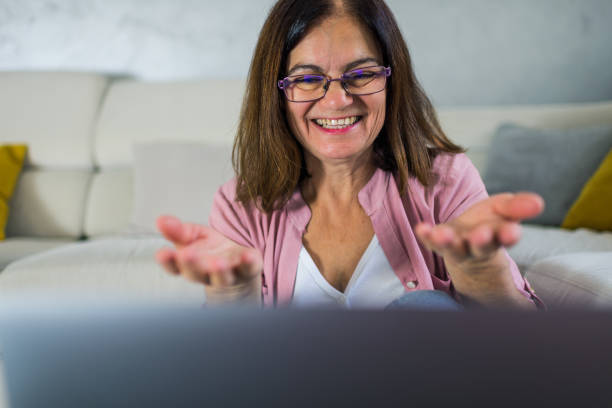 istock Senior woman on conference call 1290047779