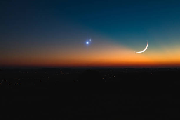 Astronomical conjunction of Saturn, Jupiter and Moon. Astronomical conjunction of Saturn, Jupiter and Moon. crescent photos stock pictures, royalty-free photos & images