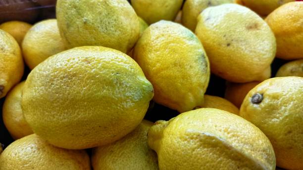 istock Vibrant yellow lemon bunch background 1290050265