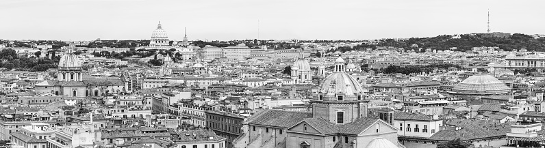 Sweeping black and white panoramic vista across the landmarks and villas, hills, domes and cupolas of Rome, Italy's beautiful capital city.