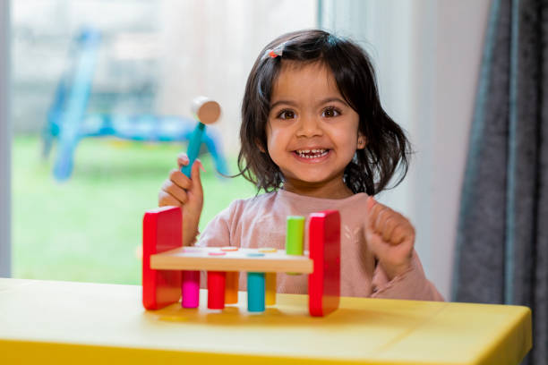 istock Toddler Playing With Early Learning Toys 1290051642