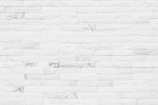 istock White grunge brick wall texture background for stone tile block painted in grey light color wallpaper modern interior and exterior and room backdrop design 1290052435