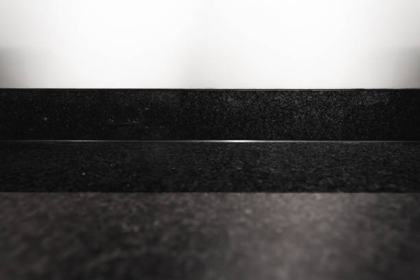 istock Blank shiny stone counter top with white wall 1290053236