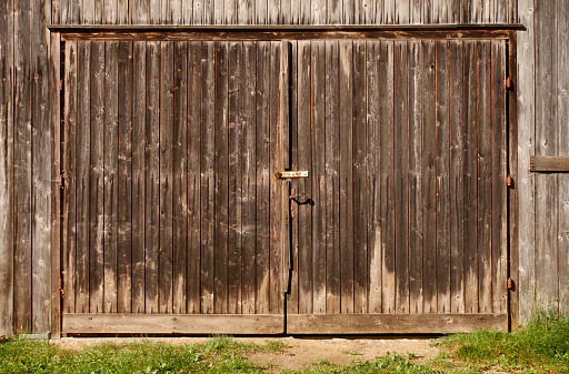 an old wooden wall with red peeling paint