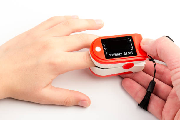 istock Pulse Oximeter, finger digital device to measure oxygen saturation in blood. Coronavirus symptoms concept. 1290053956