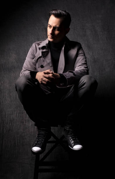 istock male model with dark grey background 1290059713