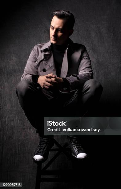 Male Model With Dark Grey Background Stock Photo - Download Image Now - Editorial, Magazine Cover, Fashion