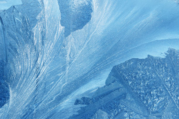 istock Frost flowers on a frozen window 1290061183