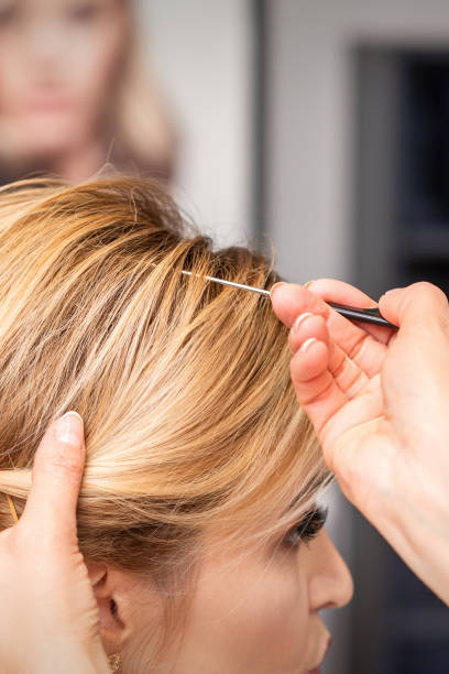 istock Woman receiving her hair done 1290062033