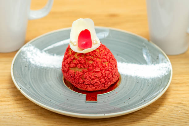 istock Red dessert shu cake on plate 1290062059