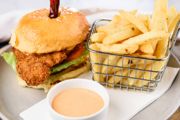 istock A fried chicken burger with lettuce and tomato 1290063590
