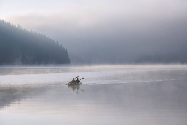 istock Two People Are Kayaking While On A Vacation In The mountains 1290063658