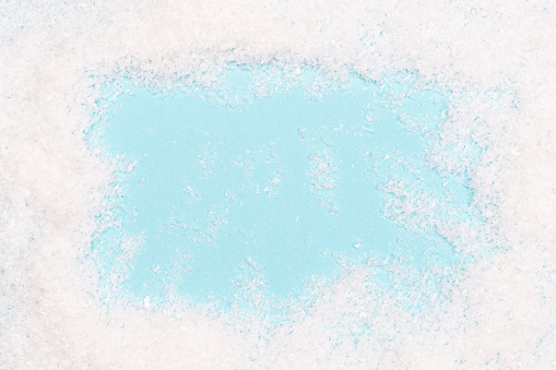 Christmas background in a shape of snow frame with blue free space