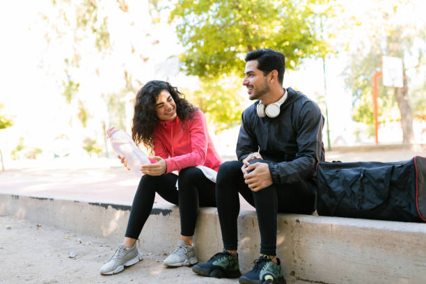 istock Hispanic couple flirting and smiling after their workout together 1290065072