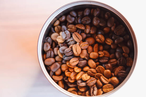 istock Roasted coffee beans in a bowl, top view 1290066253