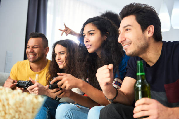 istock Friends playing games console in competition 1290066306