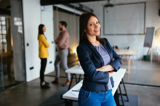 istock Businesswoman standing and looking at camera 1290067287