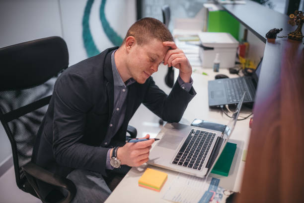istock Young Businessman Having Stress In The Office 1290068769
