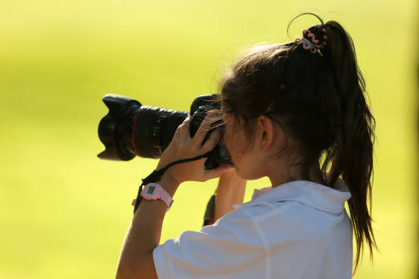 istock girl taking photos 1290068880