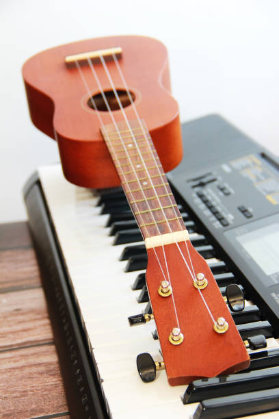 istock guitar with strings and piano with keys 1290070386