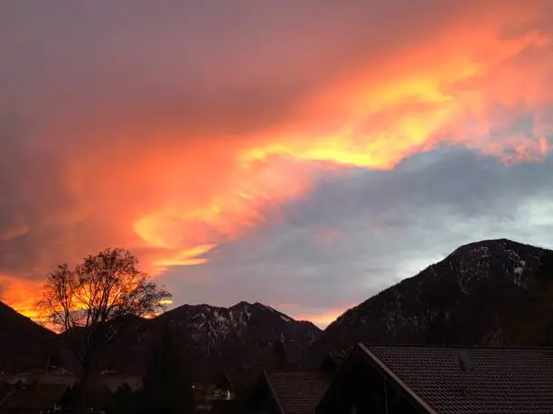 Dawn in dramatic colors over the mountains, blazing sky, flaming clouds, Upper Bavaria, Tegernsee