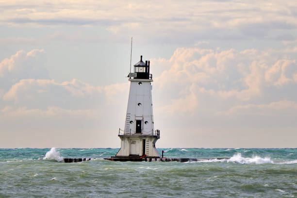 istock White lighthouse and breakwater 1290071378