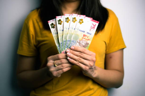 istock Woman Holding and Showing 75.000 1290073013