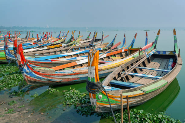 Colorful traditional wooden row boats in Amapura, near U Bein bridge, Mandalay, Burma Myanmar Colorful traditional wooden row boats in Amapura, near U Bein bridge, Mandalay, Burma Myanmar Amarapura stock pictures, royalty-free photos & images