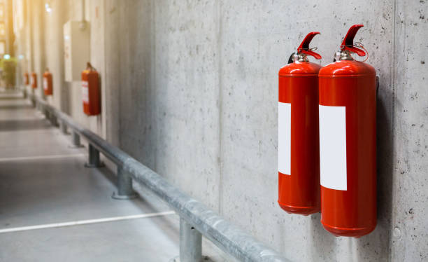 Fire extinguishers in the warehouse Fire extinguishers in the warehouse. Fire safety emergency exit photos stock pictures, royalty-free photos & images