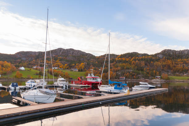 istock Coastal Norwegian landscape with moored yachts 1290074981
