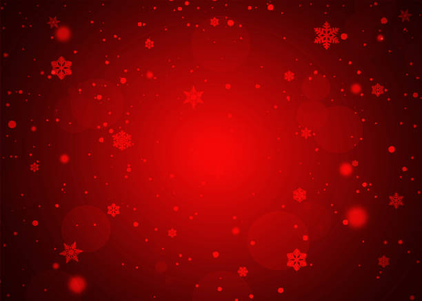 istock Winter red gradient bokeh background with snowflakes and snowfall 1290080179