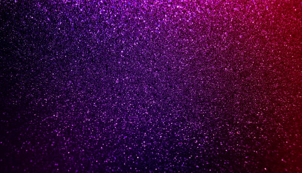 istock Shiny festive purple and red glitter texture background 1290080185