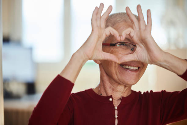 istock Senior woman sending love 1290080253