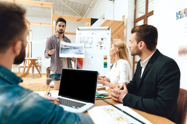 istock Team of designers architects watching presentation 1290080744