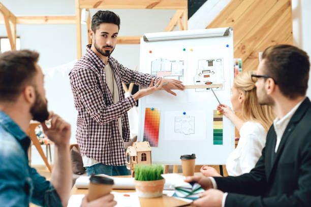 istock Team of designers architects watching presentation 1290080834